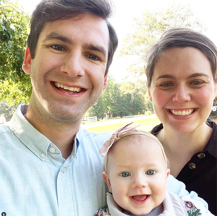 man, woman, and child smiling<br />
